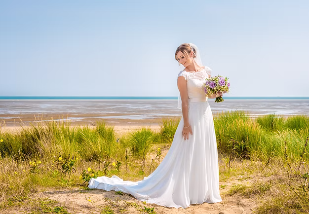 Natural wedding photography Kent bride in wedding dress on a beach with a sea background