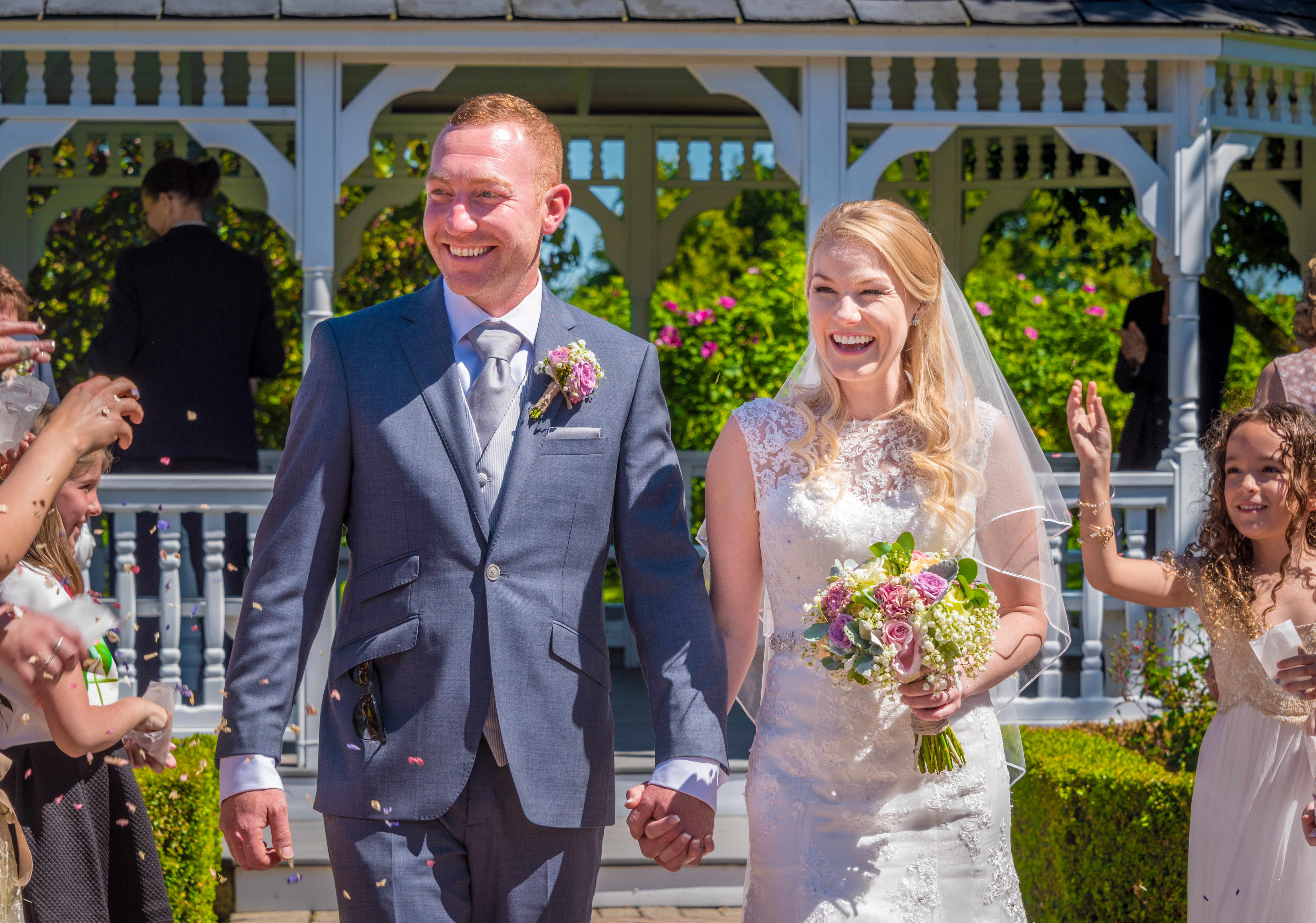 Leaving the ceremony at The Old Kent Barn Wedding Venue in Ashford