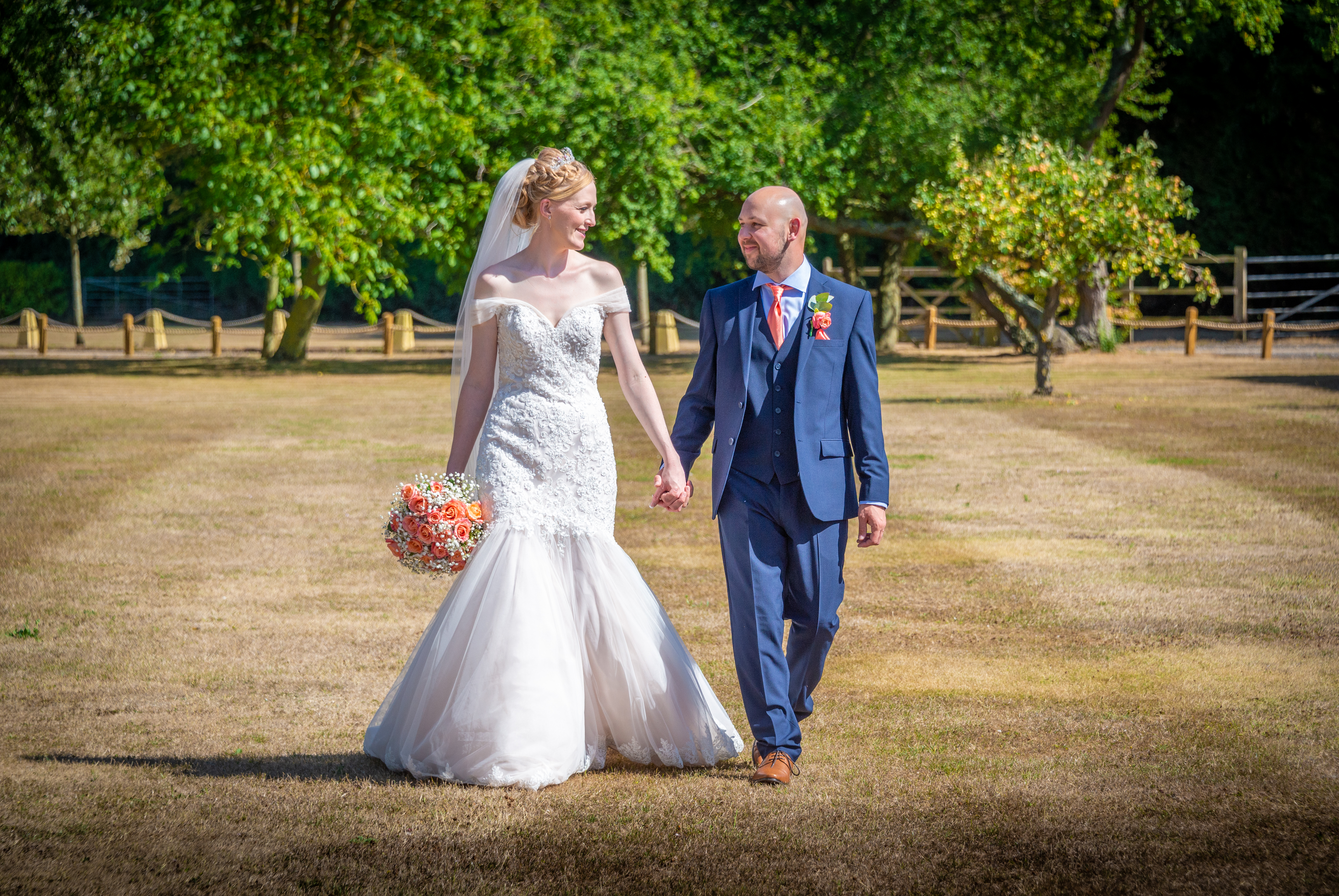 Couples photo on the lawn at Winters Barn Wedding Venue in Ashford