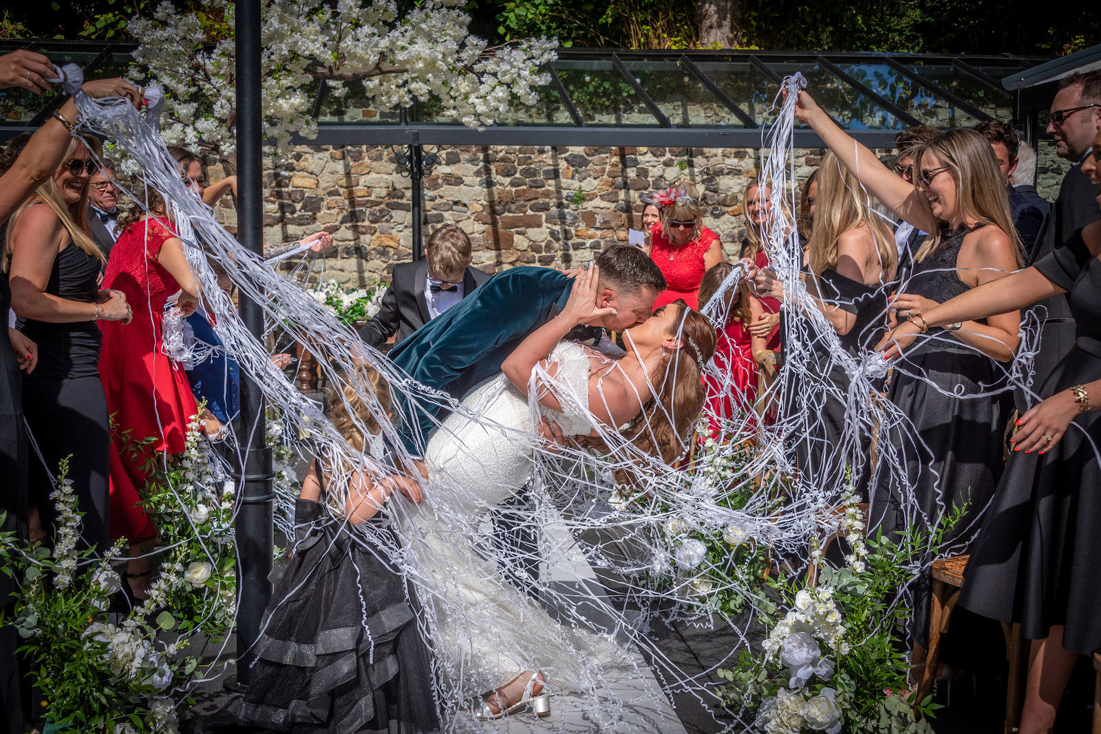 A confetti streamer celebration at the Buttery and Glasshouse wedding venue in Kent