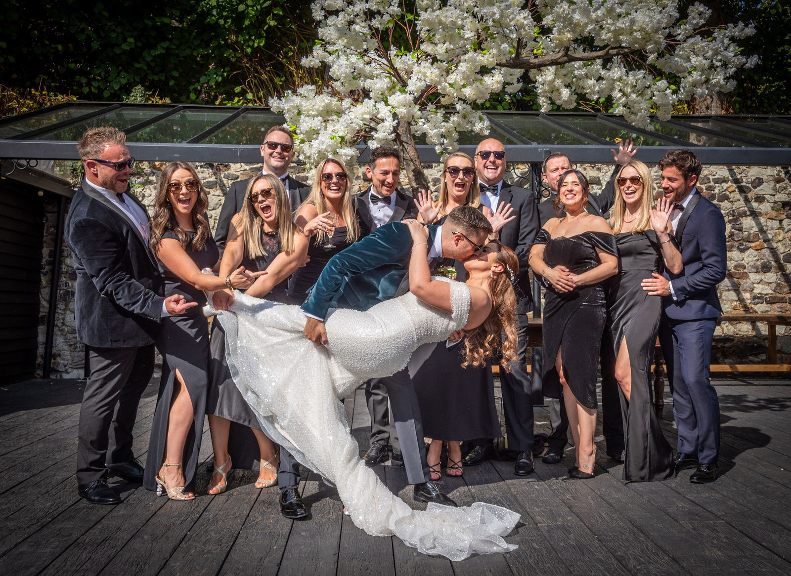 A less traditional group photo at the Buttery and Glasshouse wedding venue in Kent