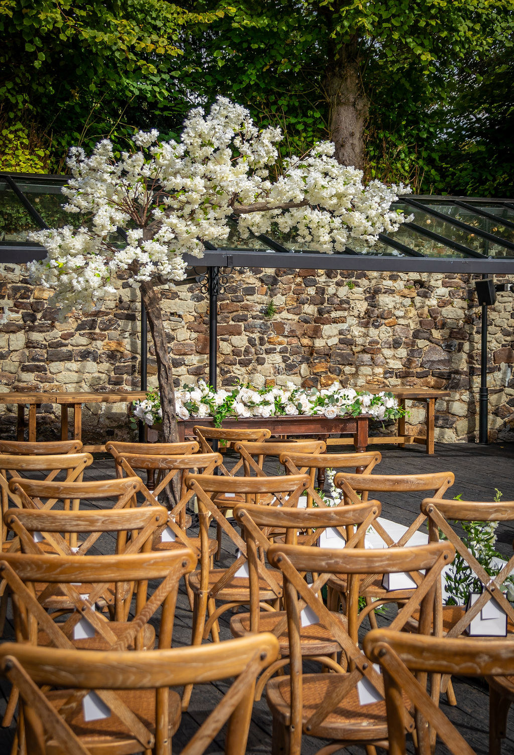 The outdoor ceremony setup at the Buttery and Glasshouse wedding venue in Kent