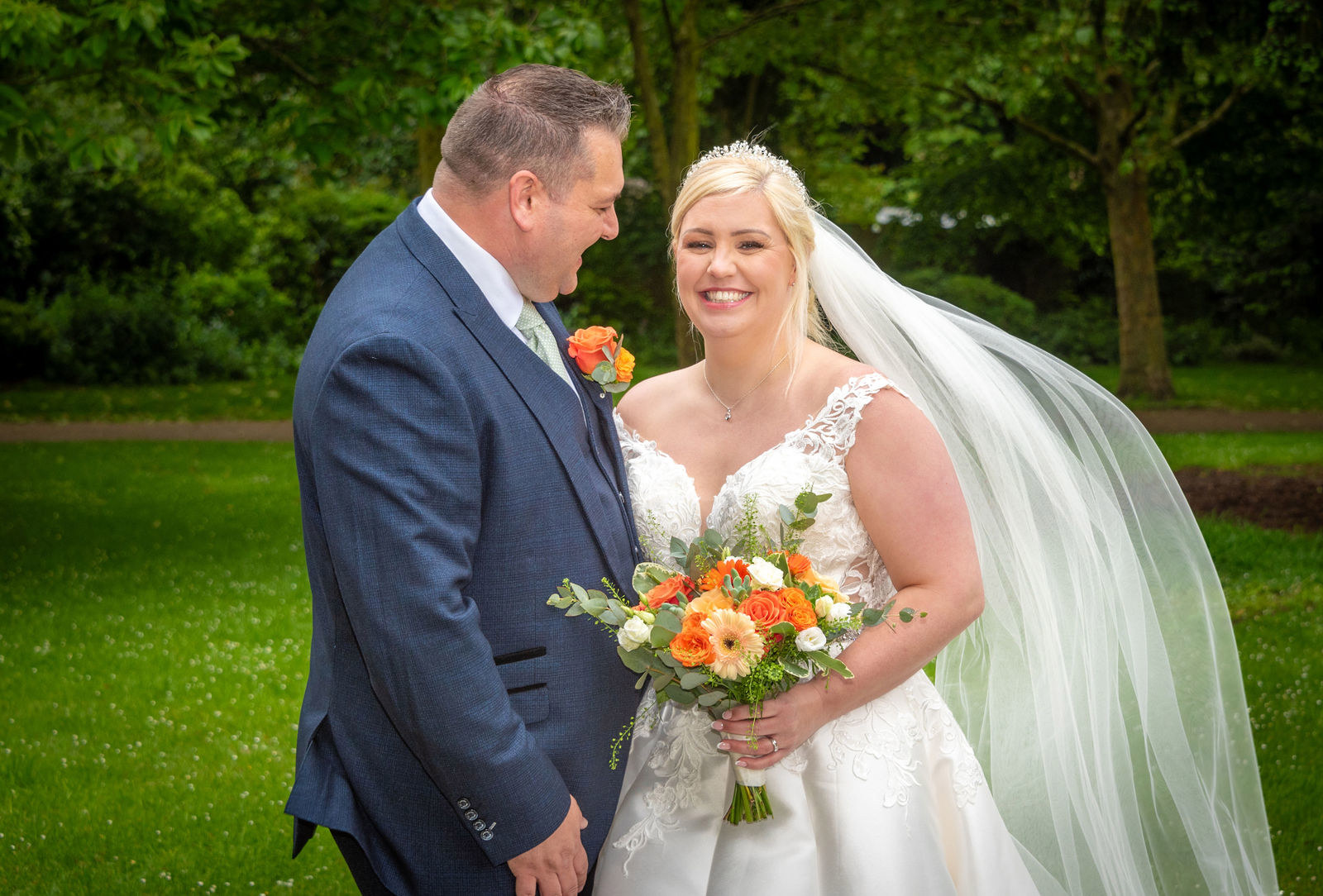 Smiling in the nearby park at The Vines of Rochester wedding venue in Kent