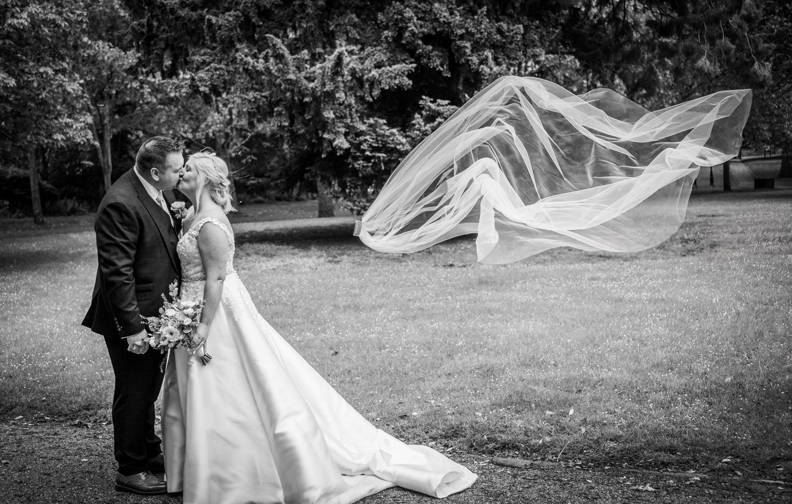 Losing the veil couples portrait at The Vines of Rochester wedding venue in Kent